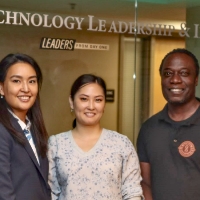 Paul Asunda (right), with three of his primary university partners in Kazakhstan.