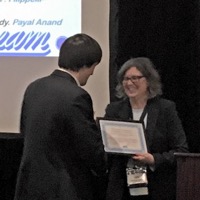 Louis Hickman (left) accepts award at the Eastern Academy of Management Conference