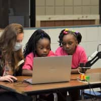  Students program the DOBOT Magician Lite, a multi-functional lightweight intelligent robotic arm, to learn how artificial intelligence and mechanics work.