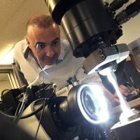 Ayhan Ince readies a metal sample for high cycle fatigue testing.