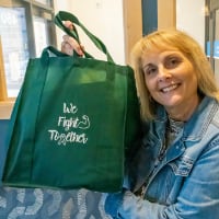 Julie LaGrange holds up a We Fight Together care package (Purdue University photo/Alison Manges)
