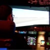 Adam Dunham, a master's student and flight instructor, flies in one of the School of Aviation and Transportation Technology's flight simulators.