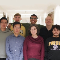 Front row, left to right: Damin Zhang (in grey sweatshirt), Yifei Hu, Julia Rayz, and Rey (Alex) Gonzalez. Back row: Jacob Zietek, Jinen Setpal, and Jack Lambert