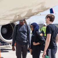Purdue University students observe the underside of a plane on Purdue Aviation Day 2022
