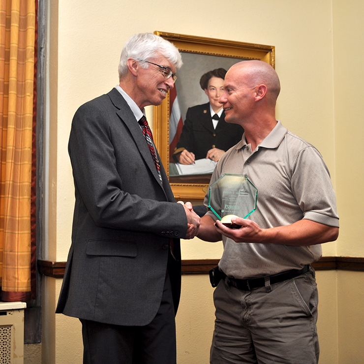 JJ Smith of ECN accepts his Outstanding Customer Service Award.