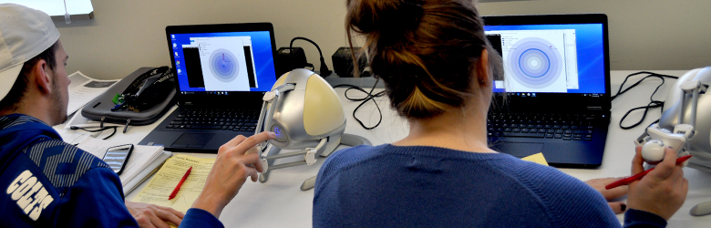 Students explore electric forces (point charge simulation on the left, ring charge simulation on the right) by using a haptic device and visual input. 