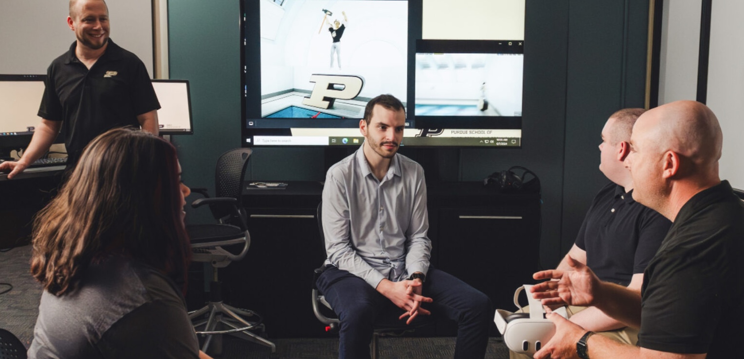 Faculty working with students on VR project