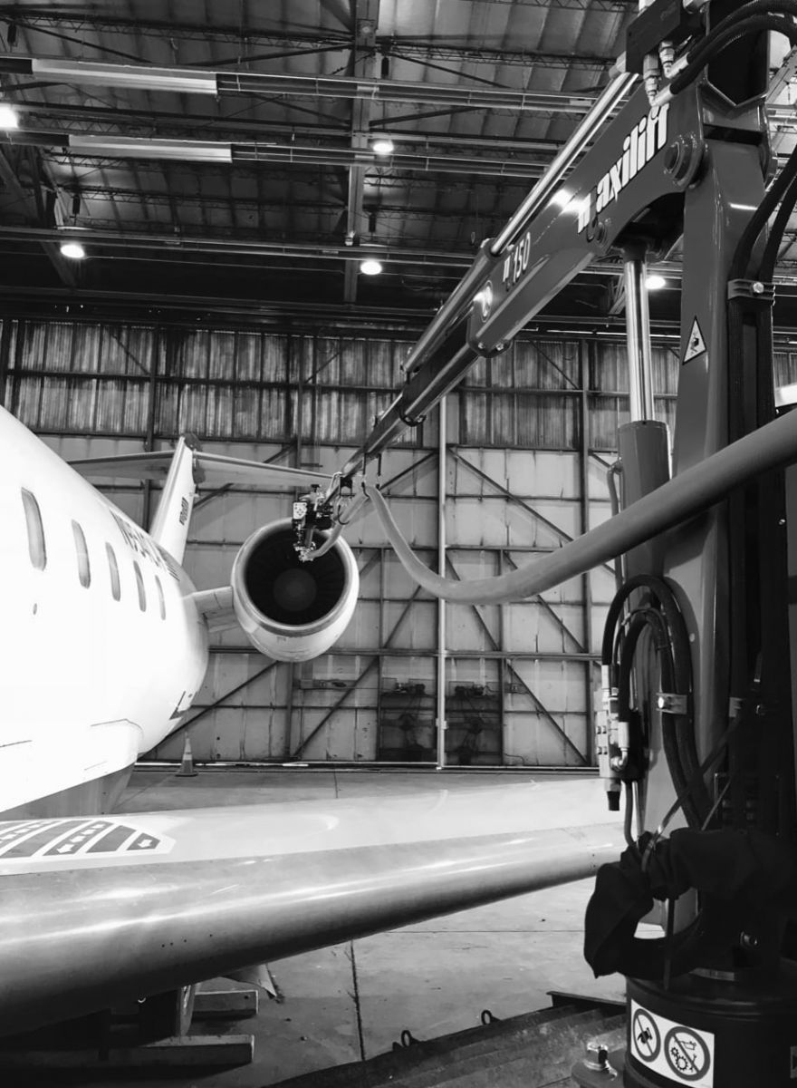 AeroCore’s equipment extending over a jet’s wing, demonstrating the company’s ability to restore across any aircraft platform