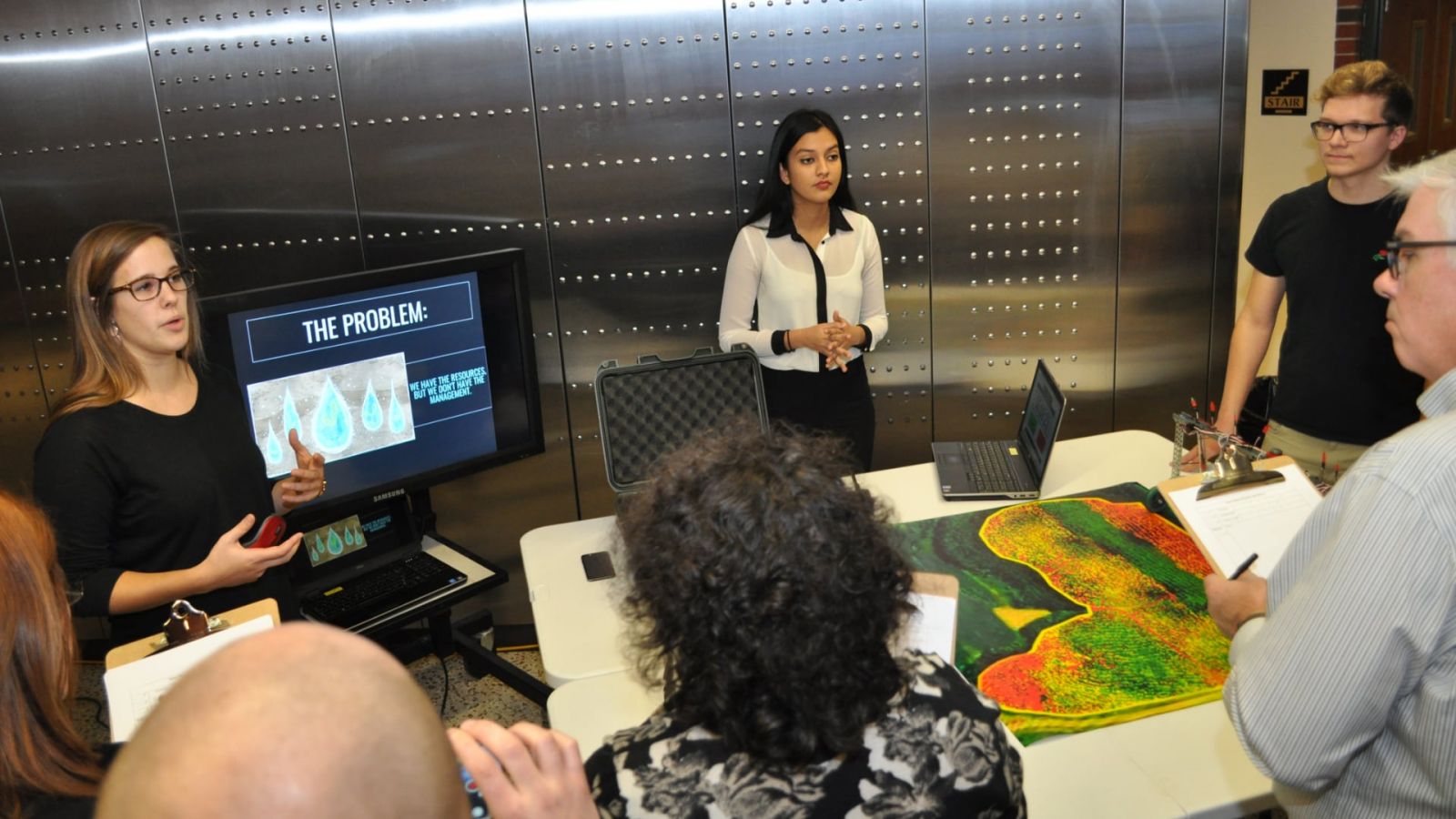 Lauren Schwab, Shaini Wilson & Jakob Kerr present their project to judges at the December 2018 at the Purdue Polytechnic Design & Innovation Challenge