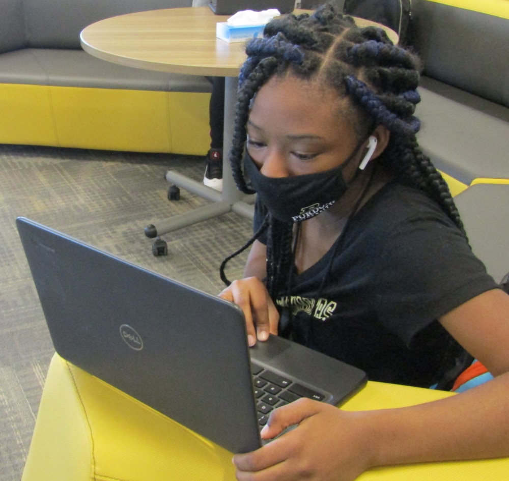 A student studying at Purdue Polytechnic High School.
