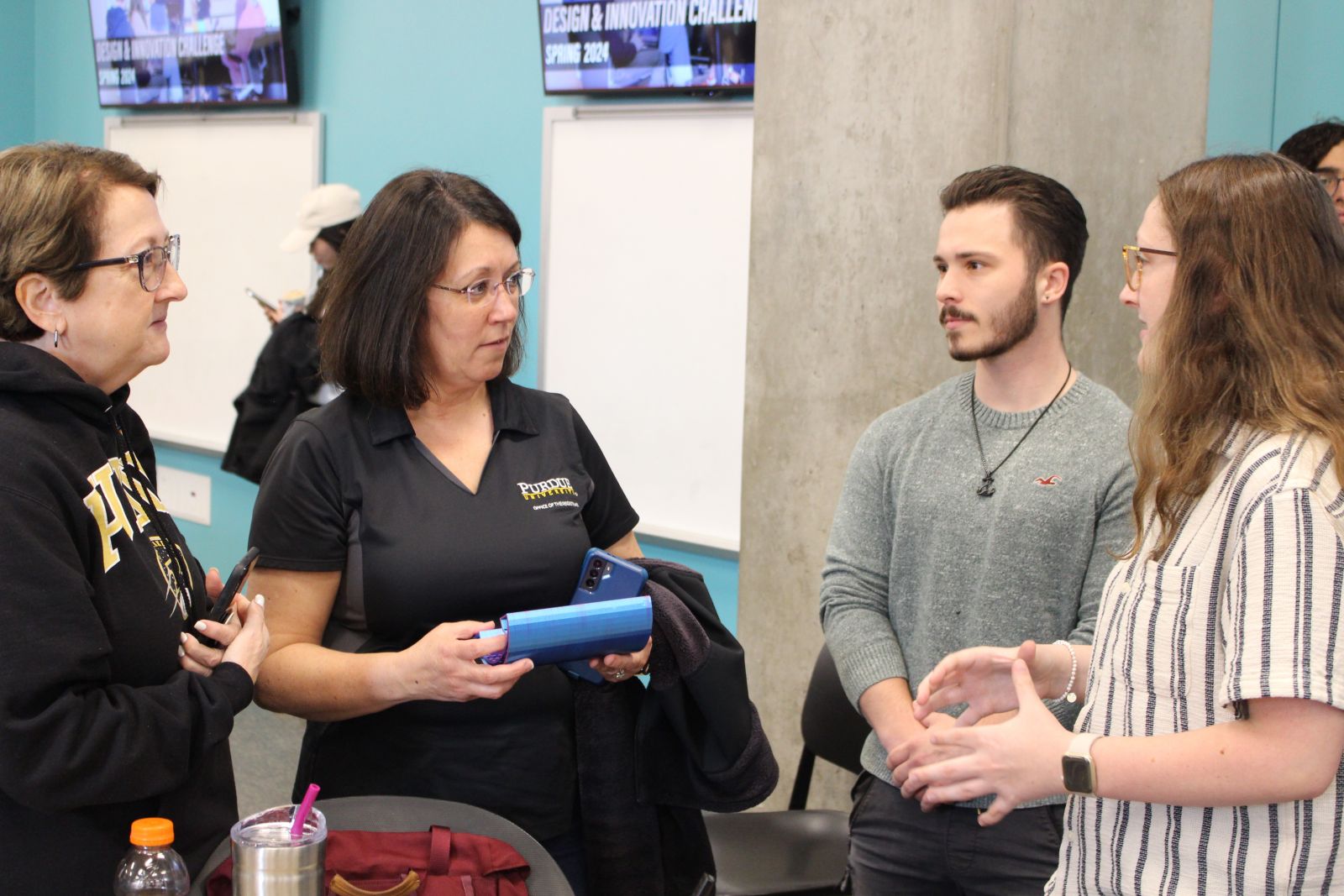 Students explain their invention at the Challenge. (Purdue University photo/Nick Pompella)