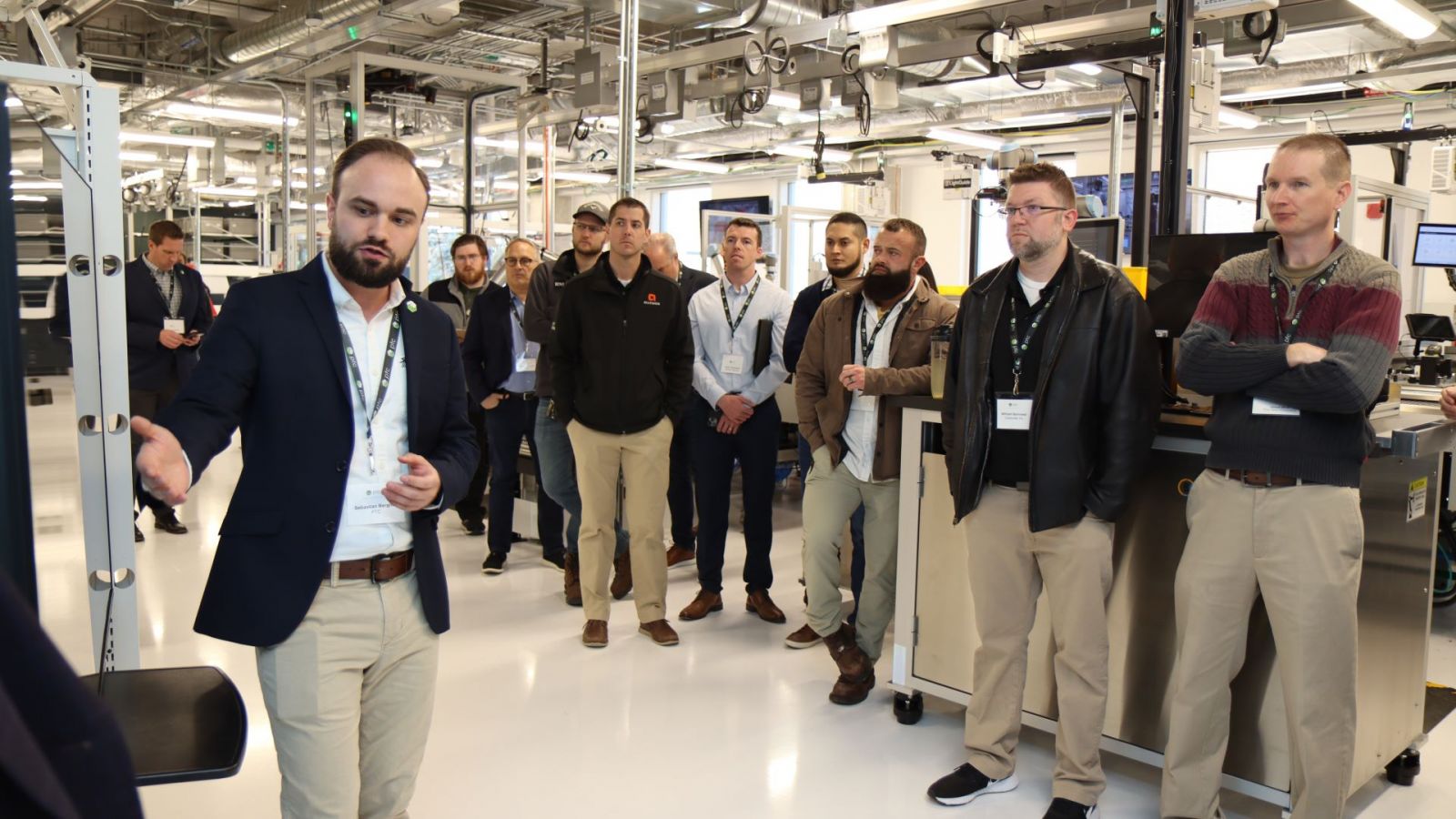 Sebastian Bergner (left) from PTC showcases several products to clients in the Smart Learning Factory. (Purdue University photo/John O'Malley)