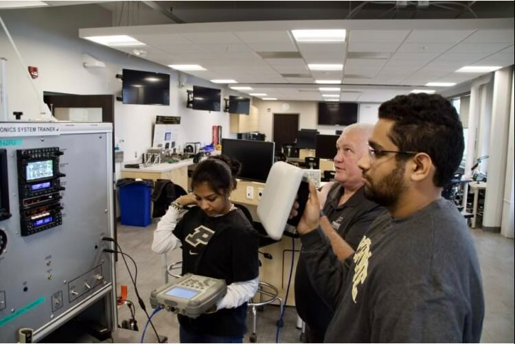 Don Barnes and students in the aeronautical engineering technology program. (Photo provided)