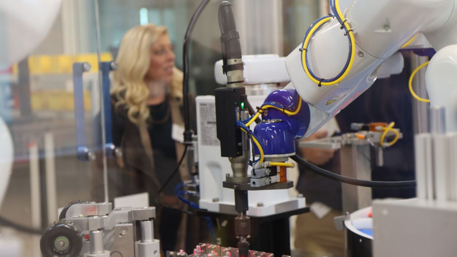 Robotic arms programmed by BBS Automation, overseen by their senior controls engineer Jim Fikert on the day of the dedication. (Purdue University photo/Zach Rodimel)