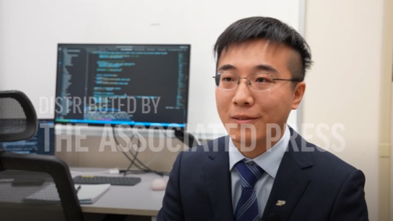 Shu Hu, pictured in an Associated Press newsroom video. (Credit: AP)