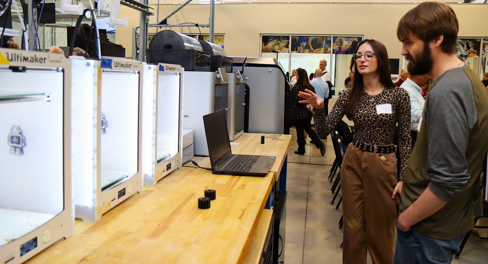 Annabelle Murry from Purdue's Digital Enterprise Center showcases 3D printers in IN-MaC's Design and Innovation Studio. (Purdue University photo/John O'Malley)