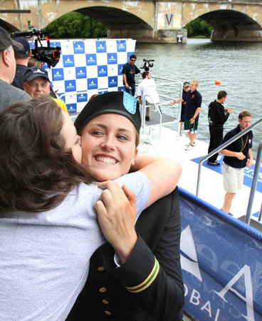 Purdue rower Rachel Young , moments before her waterfront commissioning as an officer in the Army, gets a hug from her sister Hannah. Purdue rower Rachel Young , moments before her waterfront commissioning as an officer in the Army, gets a hug from her sister Hannah.