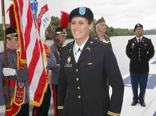 Purdue’s Rachel Young smiles after being sworn in as an Army second lieutenant between heats of the varsity eight. Purdue’s Rachel Young smiles after being sworn in as an Army second lieutenant between heats of the varsity eight.