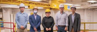 Yifu Wu (graduate research assistant), Jiansong Zhang (co-principal investigator), Jin Wei-Kocsis (principal investigator), Byung-Cheol “B.C.” Min and Dongming Gan (co-principal investigators), standing in Knoy Hall’s D. Dorsey Moss Construction Lab with an unmanned aerial vehicle and a robotic vehicle